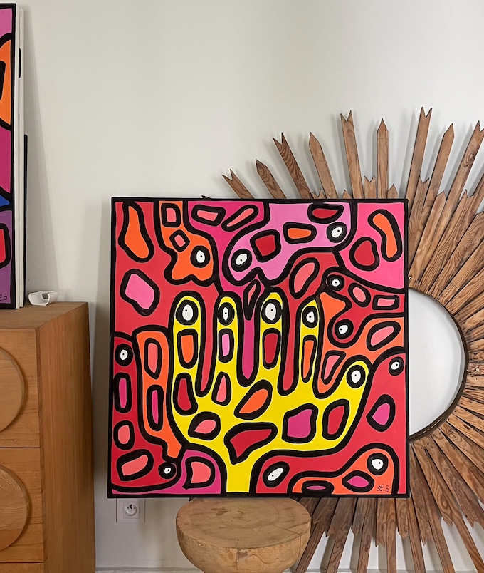 Pink and yellow hand-motif painting by Lina Sbai